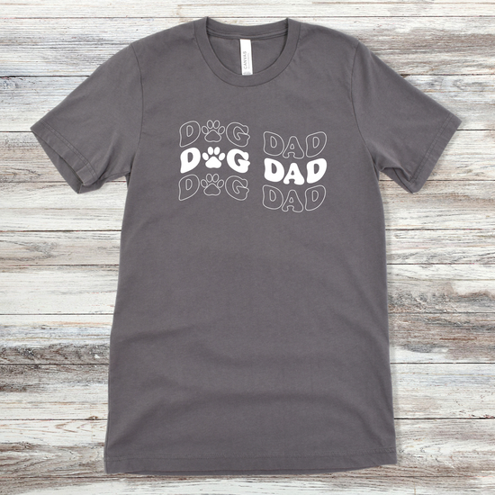 Text reading "Dog Dad" on an Asphalt Tee