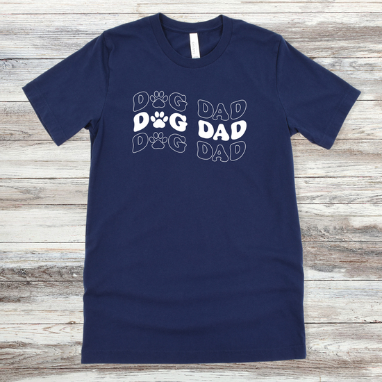 Text reading "Dog Dad" on a Navy Tee
